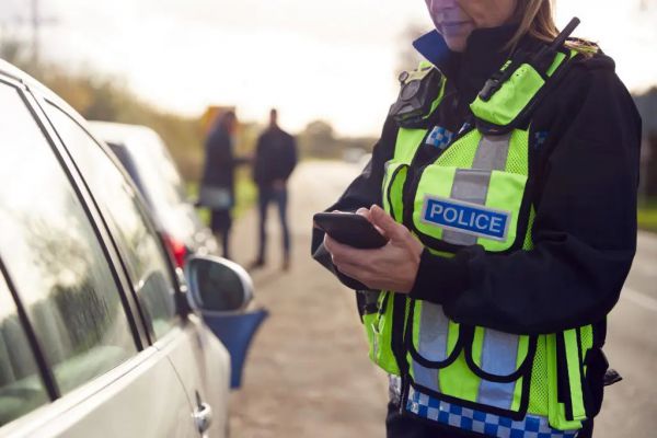 female traffic police officer recording details